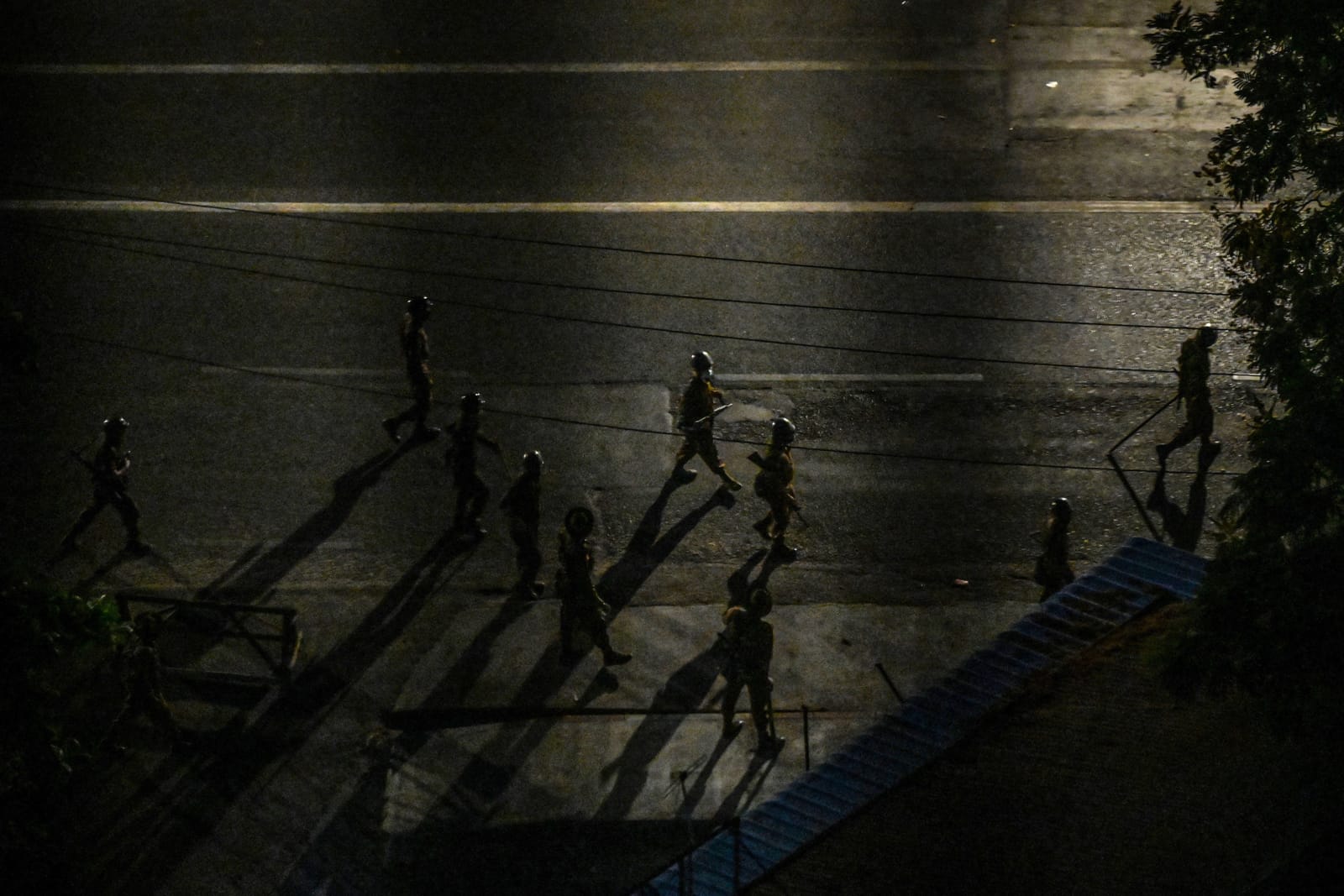 Soldiers patrolling a street in Yangon in the weeks following the 2021 coup (STR/AFP via Getty Images)