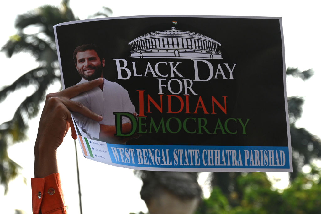 Congress members in Kolkata protest against Rahul Gandhi's conviction (Samir Jana/Hindustan Times via Getty Images)