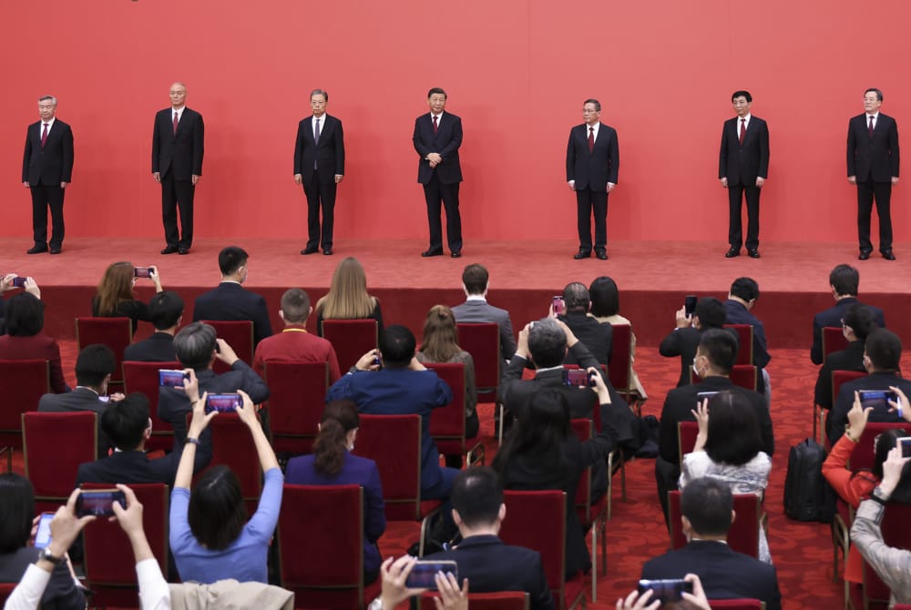 From left, Li Xi, Cai Qi, Zhao Leji, Xi Jinping, Li Qiang, Wang Huning and Ding Xuexiang, members of the standing committee of the Political Bureau of the CCP Central Committee (Lintao Zhang/Getty Images)