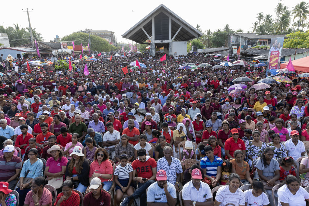 Supporters listen to Anura Kumara Dissanayake during a campaign rally in Habaraduwa, Sri Lanka, on 16 September 2024 (Buddhika Weerasinghe/Bloomberg via Getty Images)