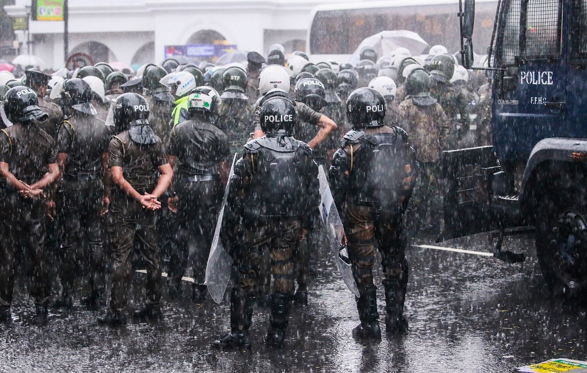 Riot police stand guard during main opposition party, the Samagi Jana Balawegaya, protest against the government they stalling of the elections and the destruction of democracy in Colombo on February 20, 2023. (Photo by Pradeep Dambarage/NurPhoto via Getty Images)