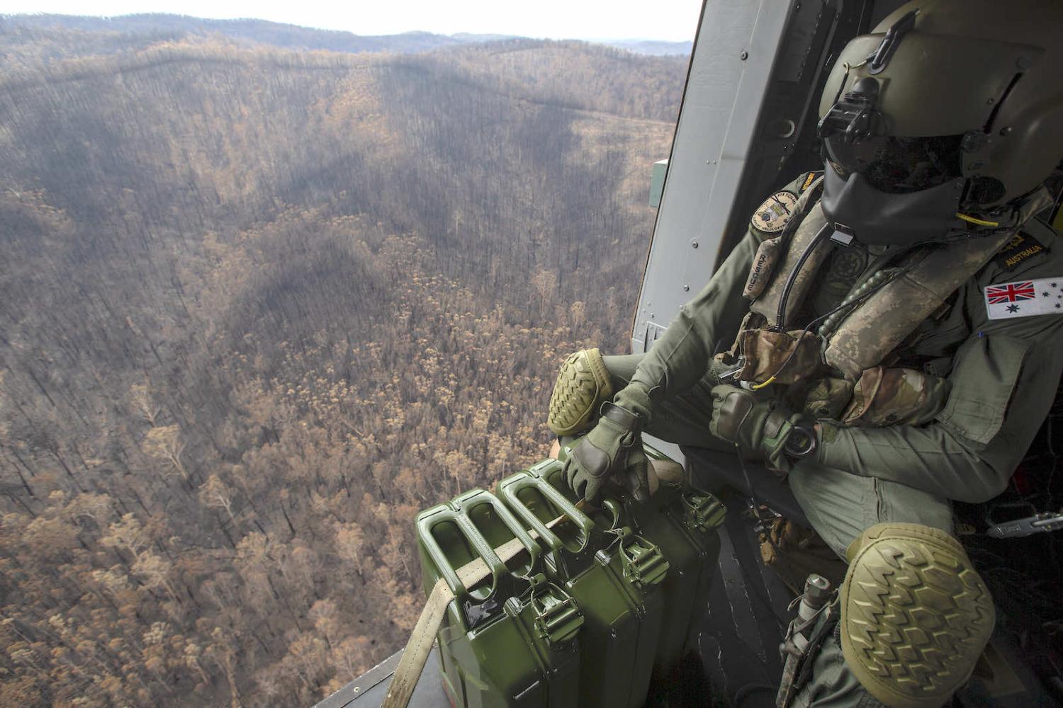 An Army helicopter over burnt countryside in New South Wales in January 2020 (Defence Department)