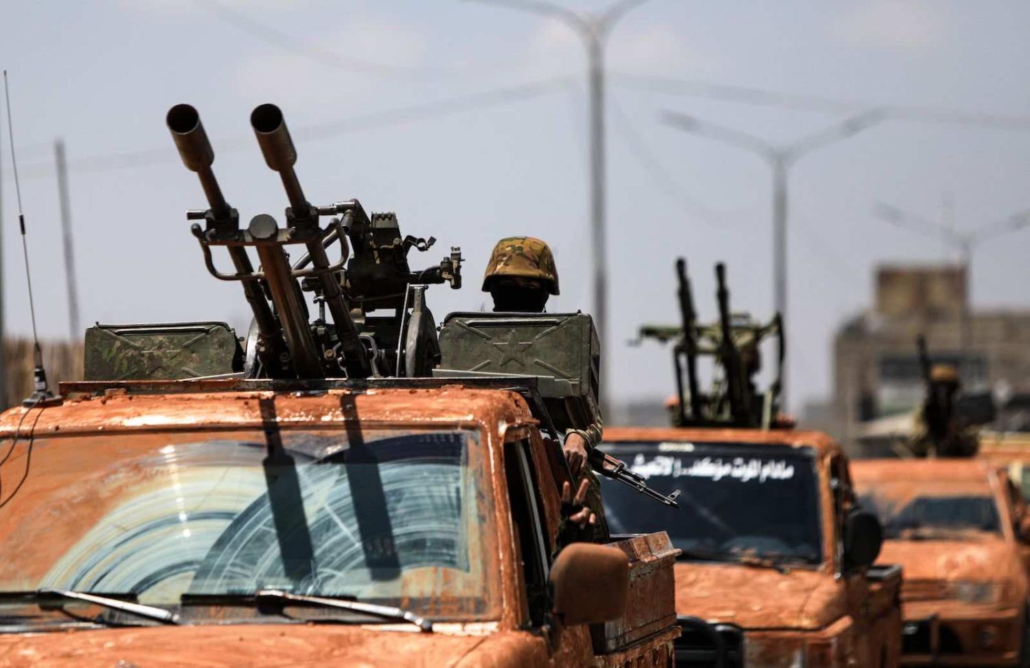 Turkish-backed Syrian rebel fighters this month near the border town of Azaz in the rebel-held northern part of Aleppo province, Syria, moving toward the Kurdish-controlled town of Tal Rifaat (Bakr Alkasem/AFP via Getty Images)