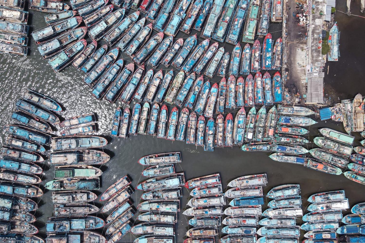 Fishing boats moored at a pier in Jakarta (Bay Ismoyo/AFP via Getty Images)