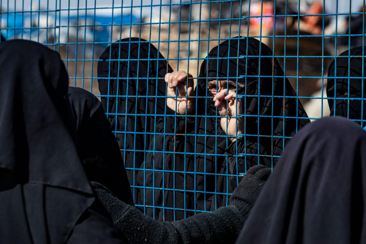 Awaiting departure during the release last year of a group of families from the Kurdish-run al-Hol camp which holds suspected relatives of Islamic State group fighters, in Hasakeh governorate of northeastern Syria (Delil Souleiman/AFP via Getty Images)