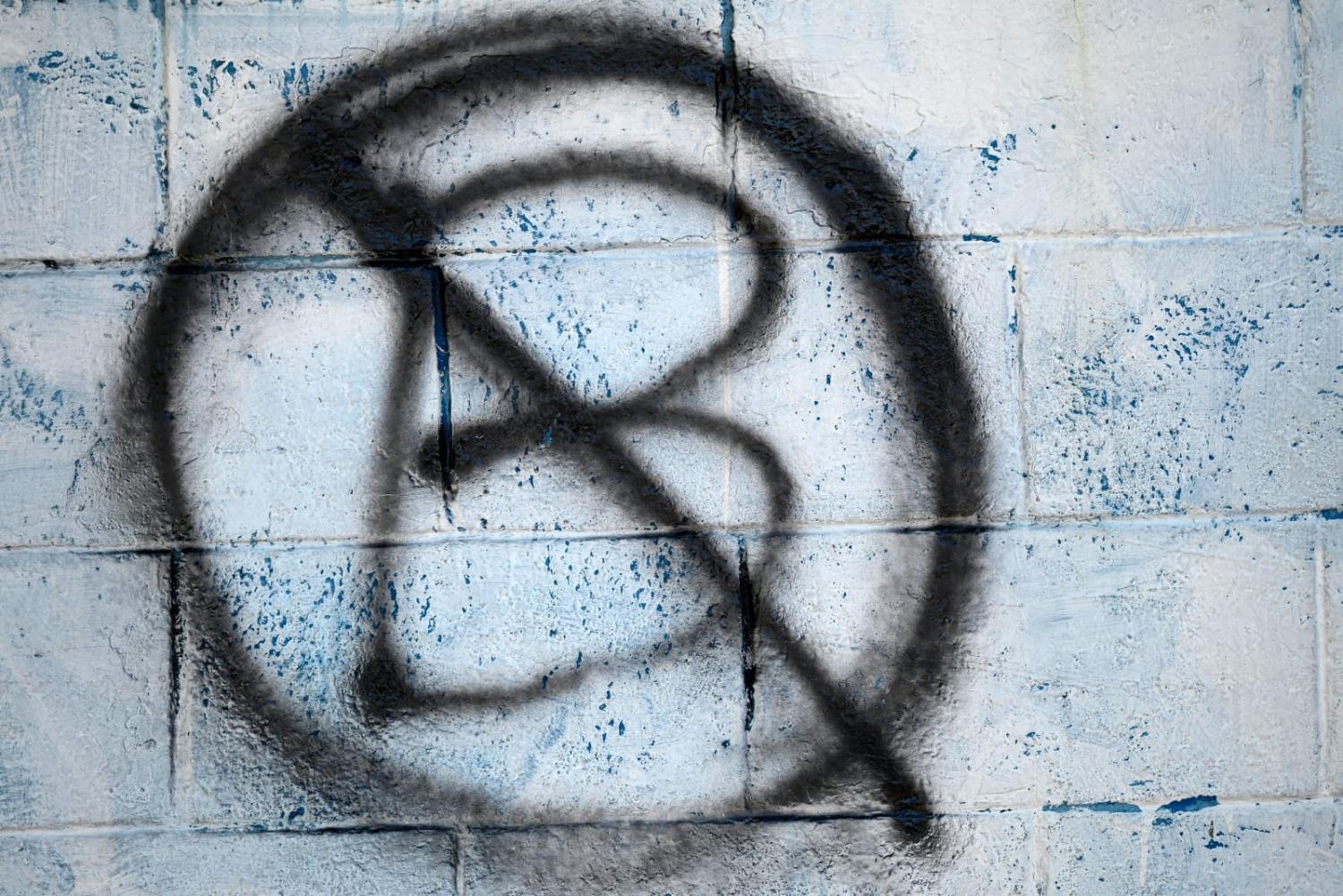 A graffiti protest against the circulation of Bitcoin in El Salvador in November after becoming the first country to make the cryptocurrency legal tender (Marvin Recinos/AFP via Getty Images)