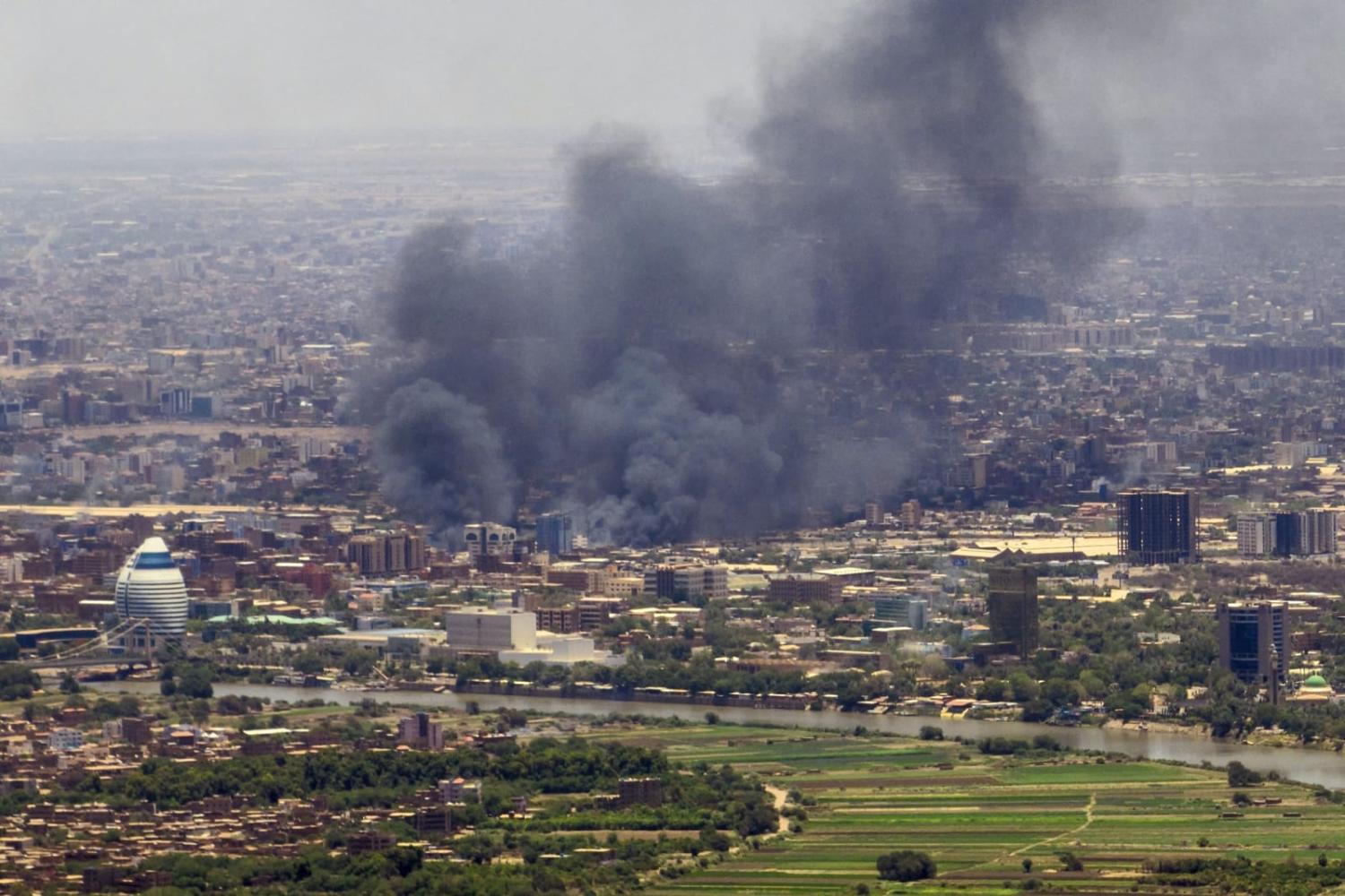 Smoke billows during fighting in the Sudanese capital Khartoum on 3 May (AFP via Getty Images) 