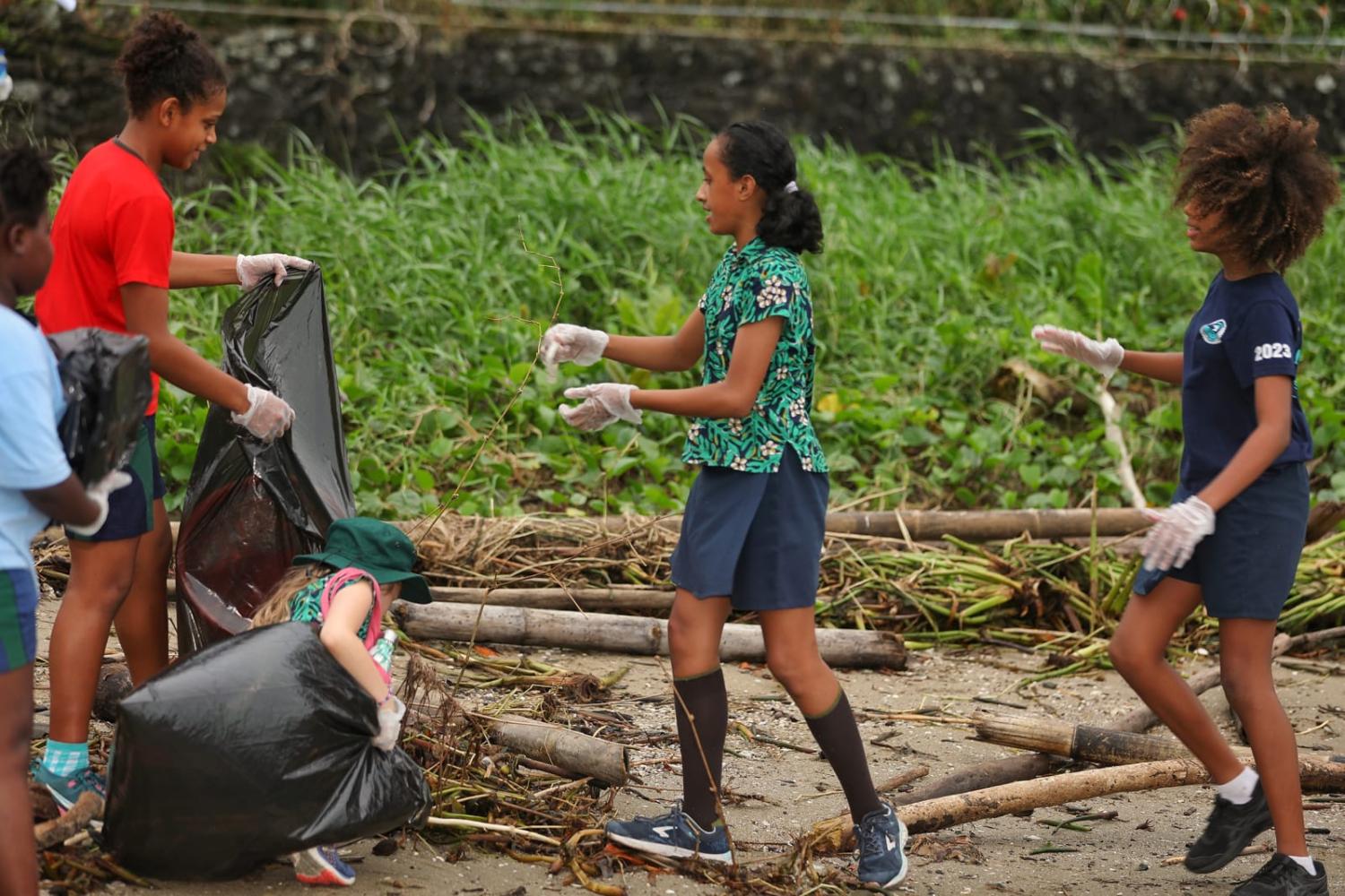 Fostering sustainable development is one priority for Fijian youth: students in Suva clean up a beach to mark World Oceans Day on 8 June (Sang Qinlong/Xinhua via Getty Images)