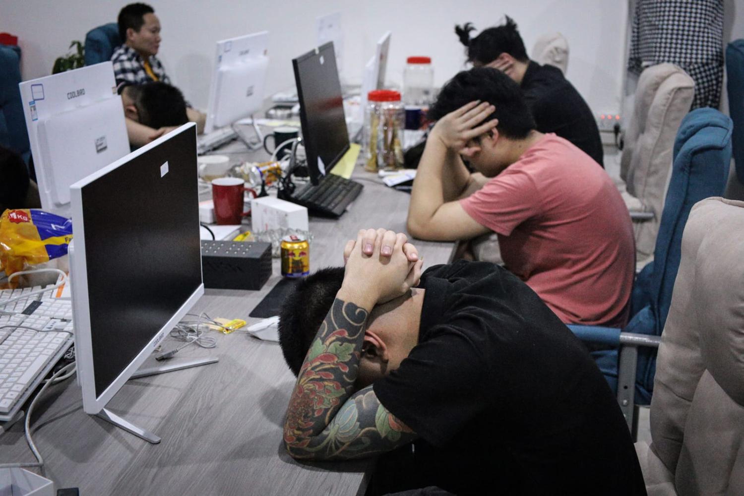 Arrests in August this year during a police raid on suspicion of running an online scam syndicate at a building of the Kara Industrial Park in Batam, in Indonesia's Riau Islands province (STR/AFP via Getty Images)