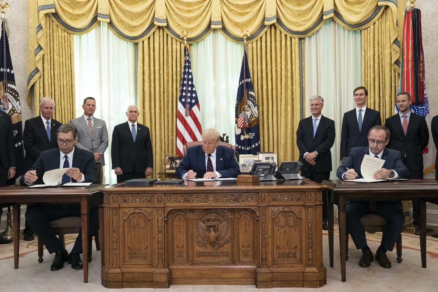 President Donald Trump (centre) in a signing ceremony with Serbian President Aleksandar Vucic (left) and Kosovo Prime Minister Avdullah Hoti on 4 September (White Houe/Flickr)