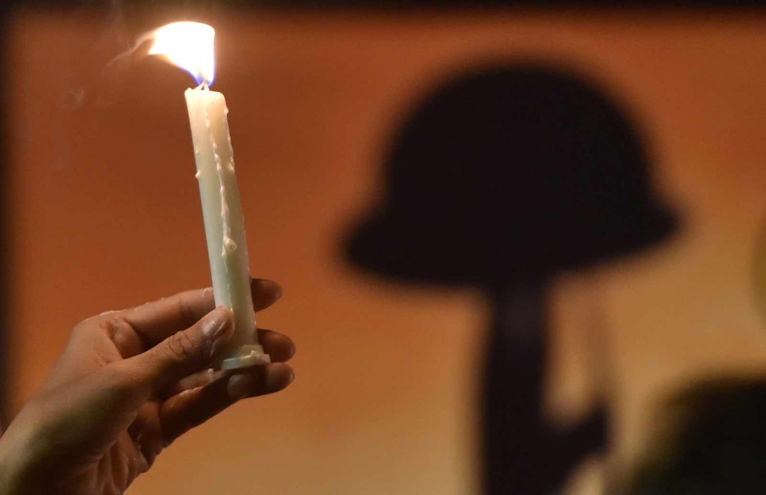 Tributes to the slain following the 14 February attack (Photo: Mohd Zakir via Getty)