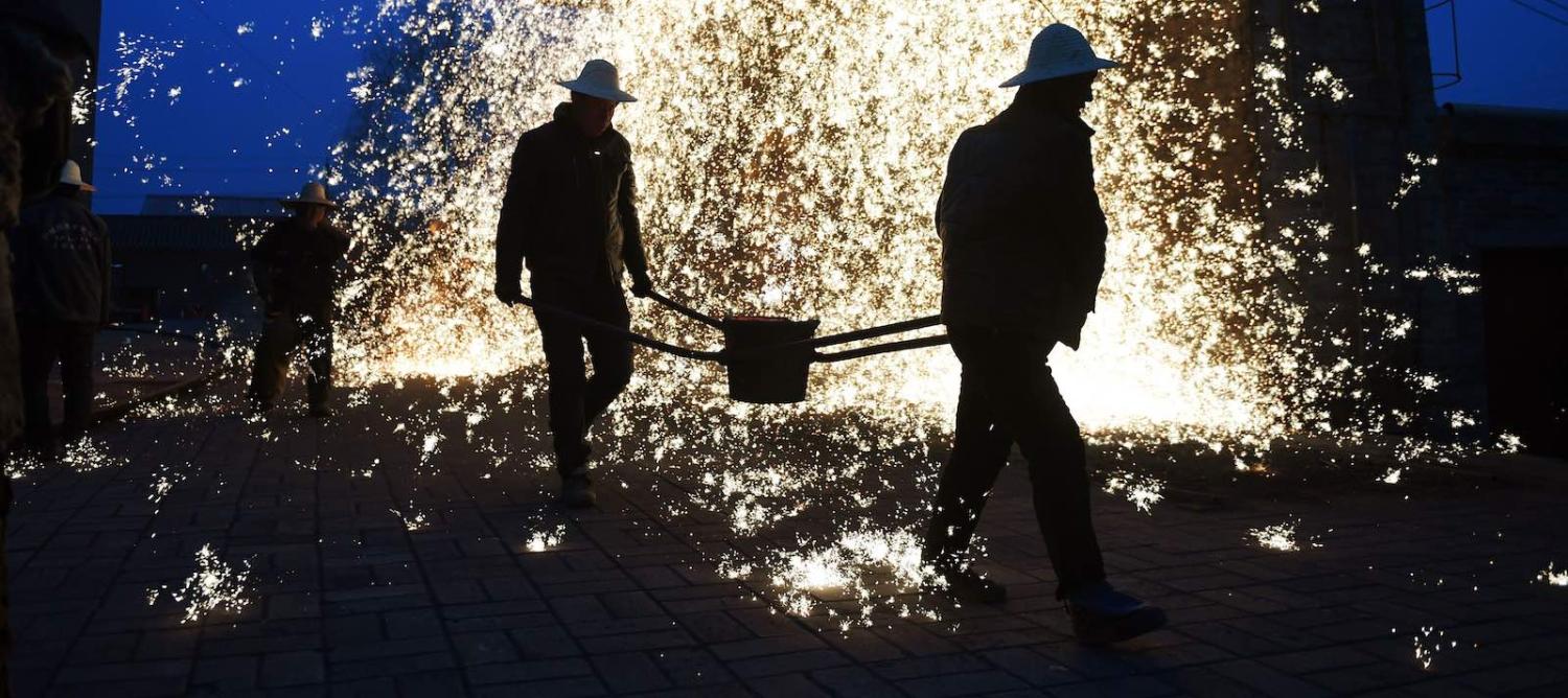 Blacksmiths in Nuanquan, China, on the eve of the Lantern Festival in February (Photo: Greg Baker via Getty)