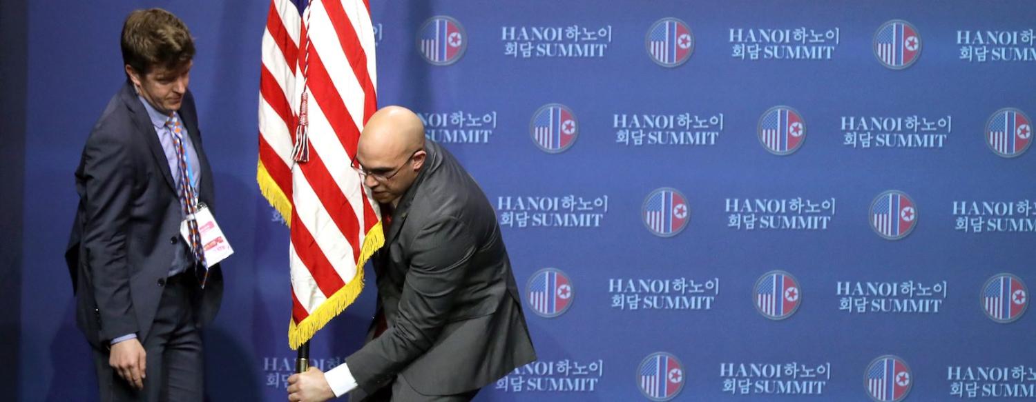 Officials arrange the stage before a press conference in Hanoi by US President Donald Trump (Photo: SeongJoon Cho/Flickr)