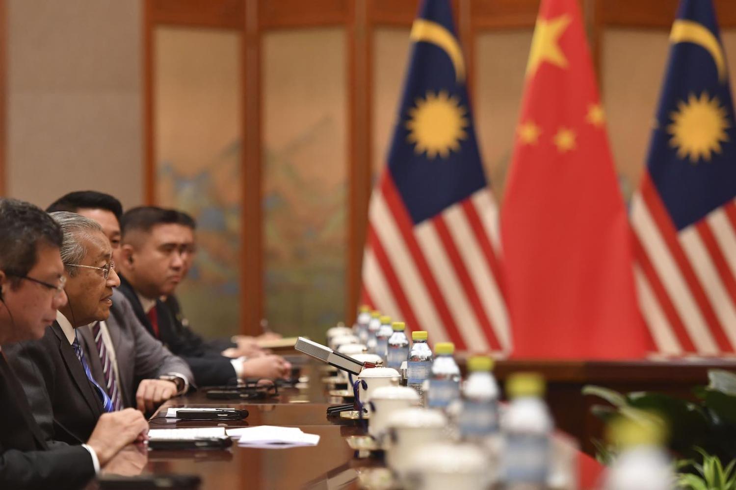 From Belt and Road critic to “full support” (Photo: Parker Song via Getty)