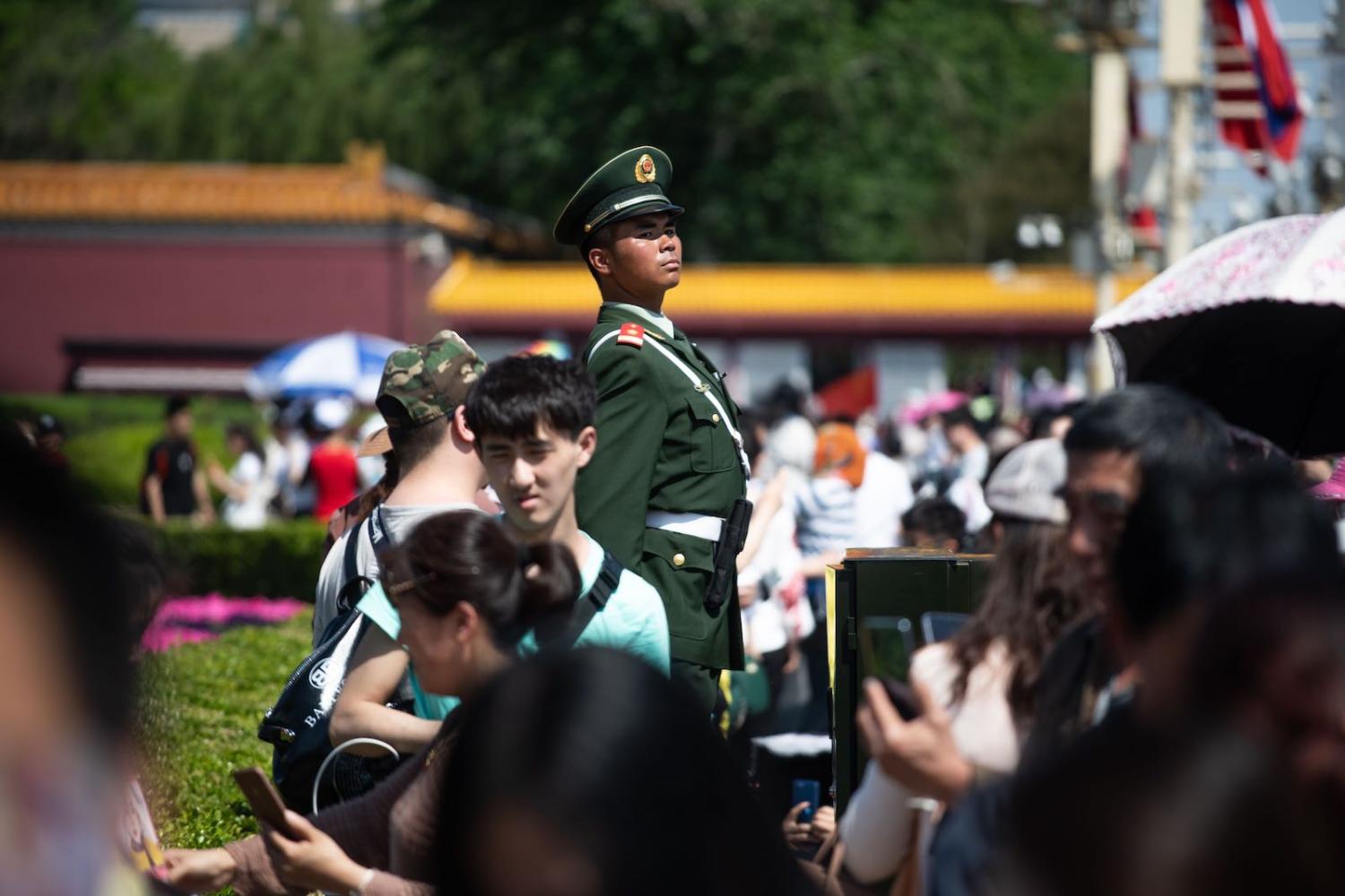 On watch: police near Tiananmen Square on 1 May, Labour Day (Photo: Fred Dufour via Getty)