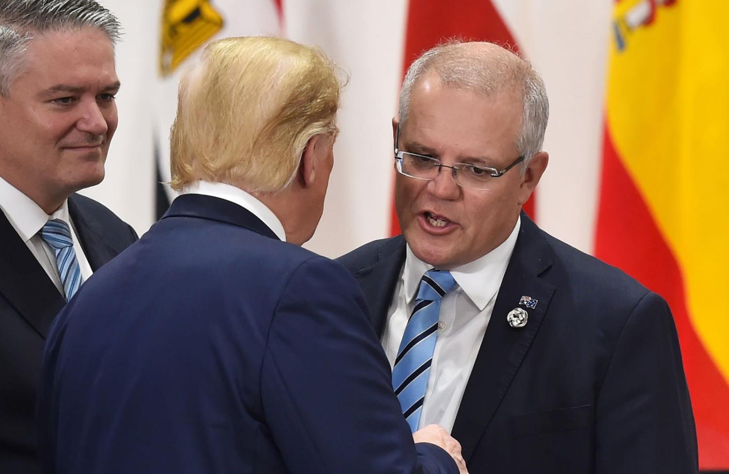 Australian PM Scott Morrison (r) speaks with US President Donald Trump at the G20 summit in Osaka, Japan, 29 June 2019. (Photo: Kazuhiro Nogi via Getty)