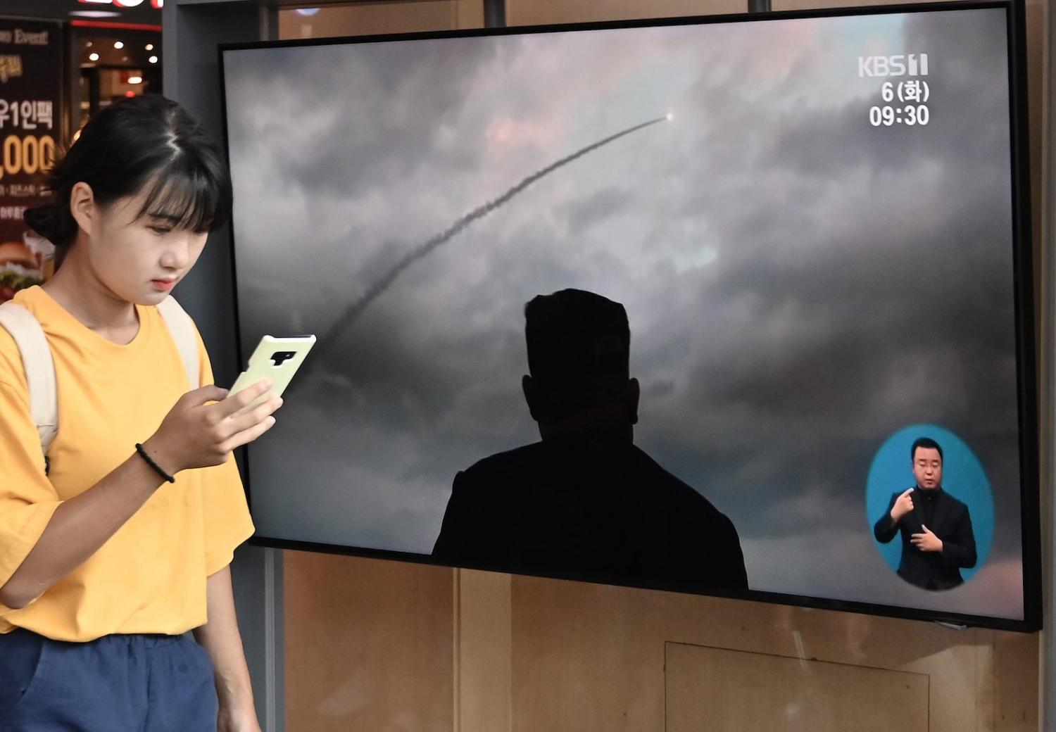 Footage of the latest North Korean missile test is broadcast at a railway station in Seoul (Photo: Jung Yeon-je via Getty)
