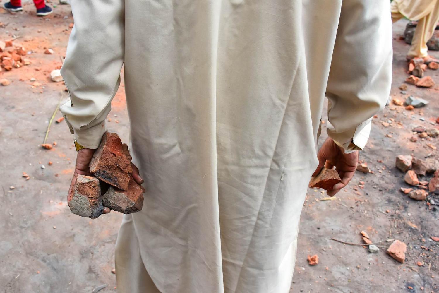 Gathering stones during clashes between demonstrators and Indian authorities in Srinagar (Photo: Muzamil Mattoo/NurPhoto via Getty)