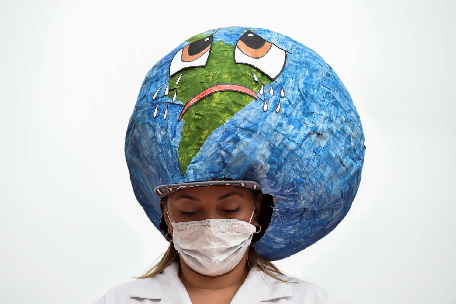 It’s easy to feel overwhelmed and impotent in the face of the manifold problems that currently confront the world (Luis Robayo/AFP via Getty Images)