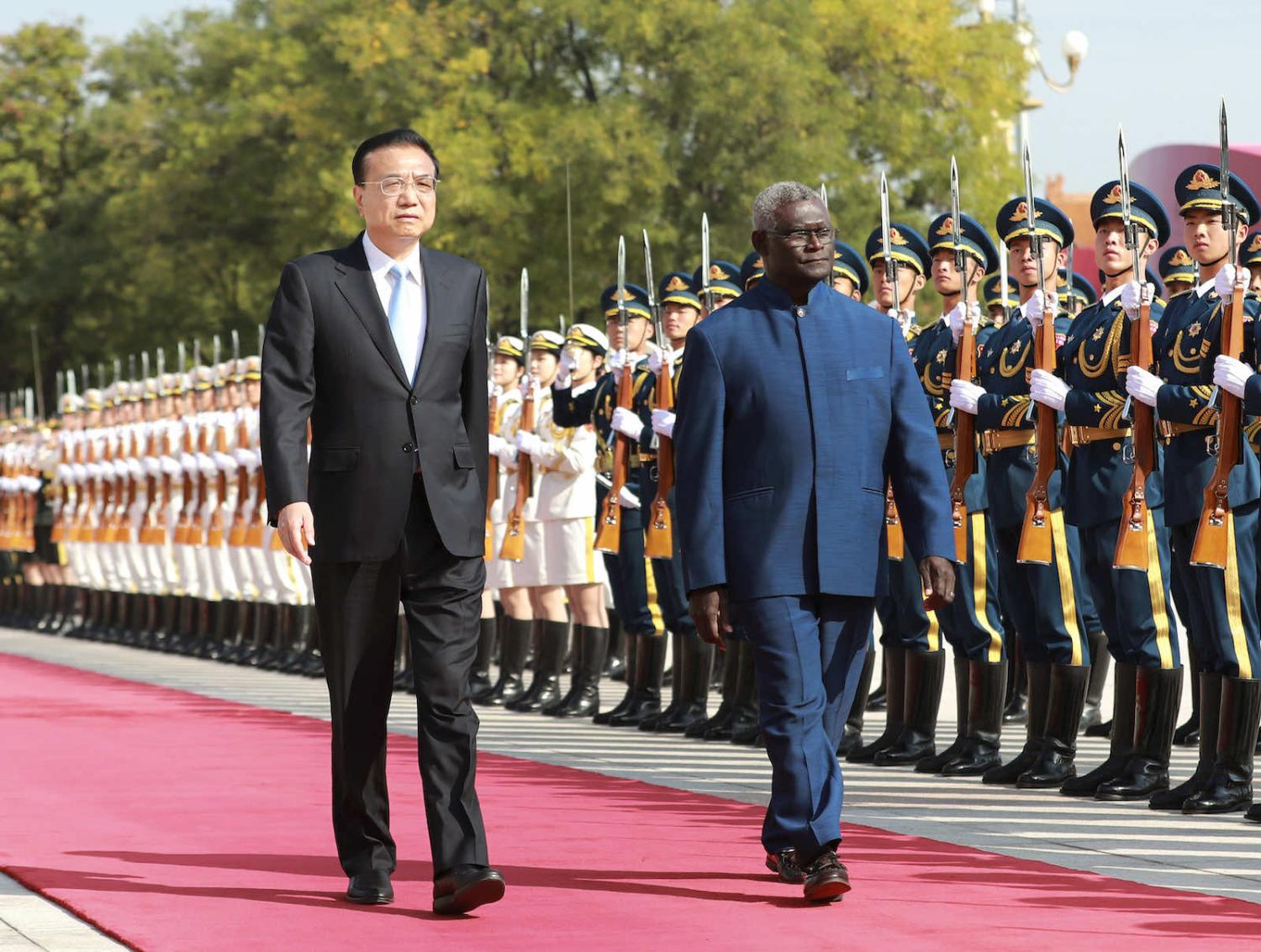Chinese Premier Li Keqiang, left, welcomes Solomon Islands' Prime Minister Manasseh Sogavare to Beijing in October 2019 following the Solomons switch in diplomatic recognition from Taiwan (Pang Xinglei/Xinhua via Getty)