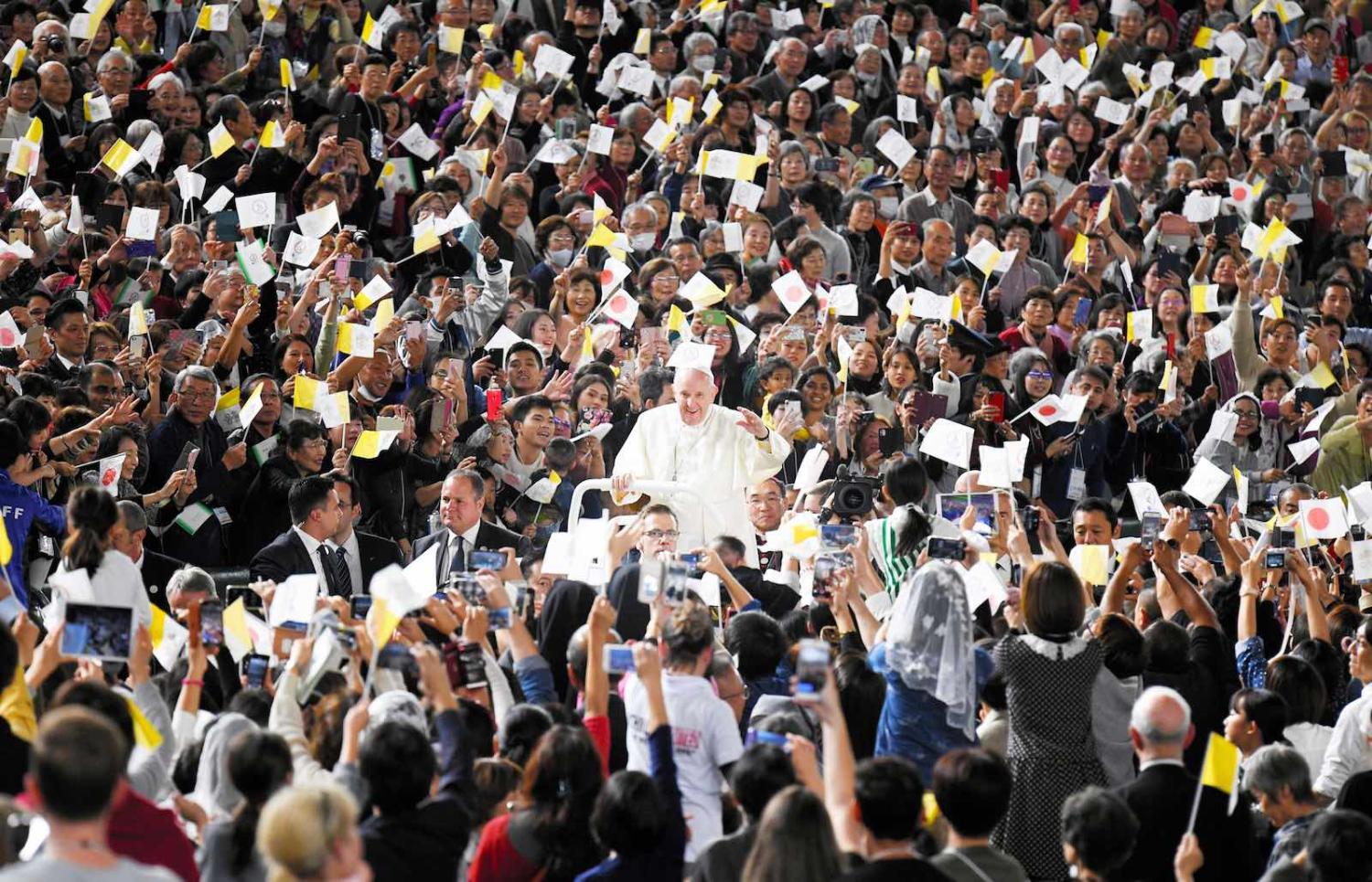 Pope Francis waves during Holy Mass at Tokyo Dome on 25 November (Photo: Asahi Shimbun via Getty Images)