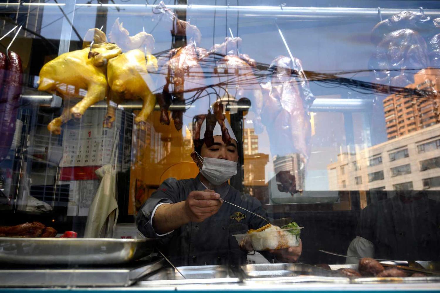 A restaurant window in Shanghai, 18 February (Noel Celis/AFP via Getty Images)