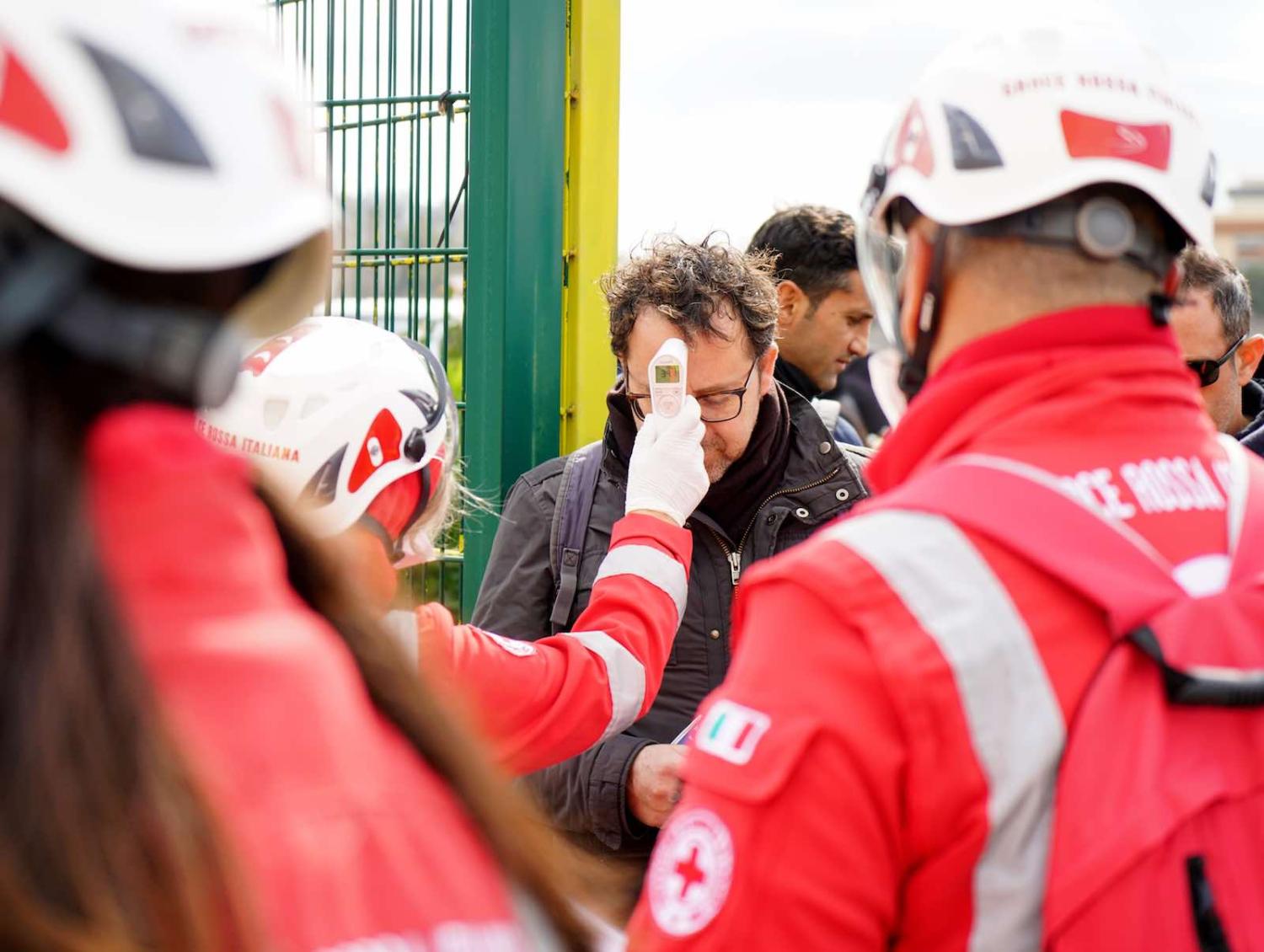 Health workers screening spectators before a soccer match in Lecce, Italy, 1 March (Gabriele Maricchiolo/NurPhoto via Getty Images)