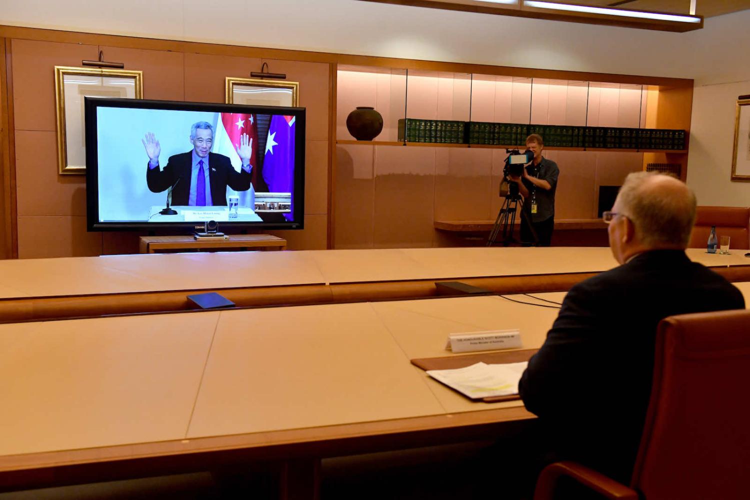 Australian Prime Minister Scott Morrison and Singapore’s Prime Minister Lee Hsien Loong during virtual summit last year after agreeing to sign a Comprehensive Strategic Partnership (Mick Tsikas via Getty Images)