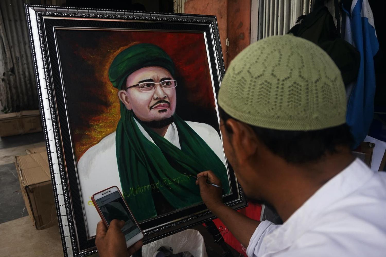 A street painter’s portrait of cleric Rizieq Shihab in Palembang, Indonesia, 4 September 2020 (Sigit Prasetya/NurPhoto via Getty Images)