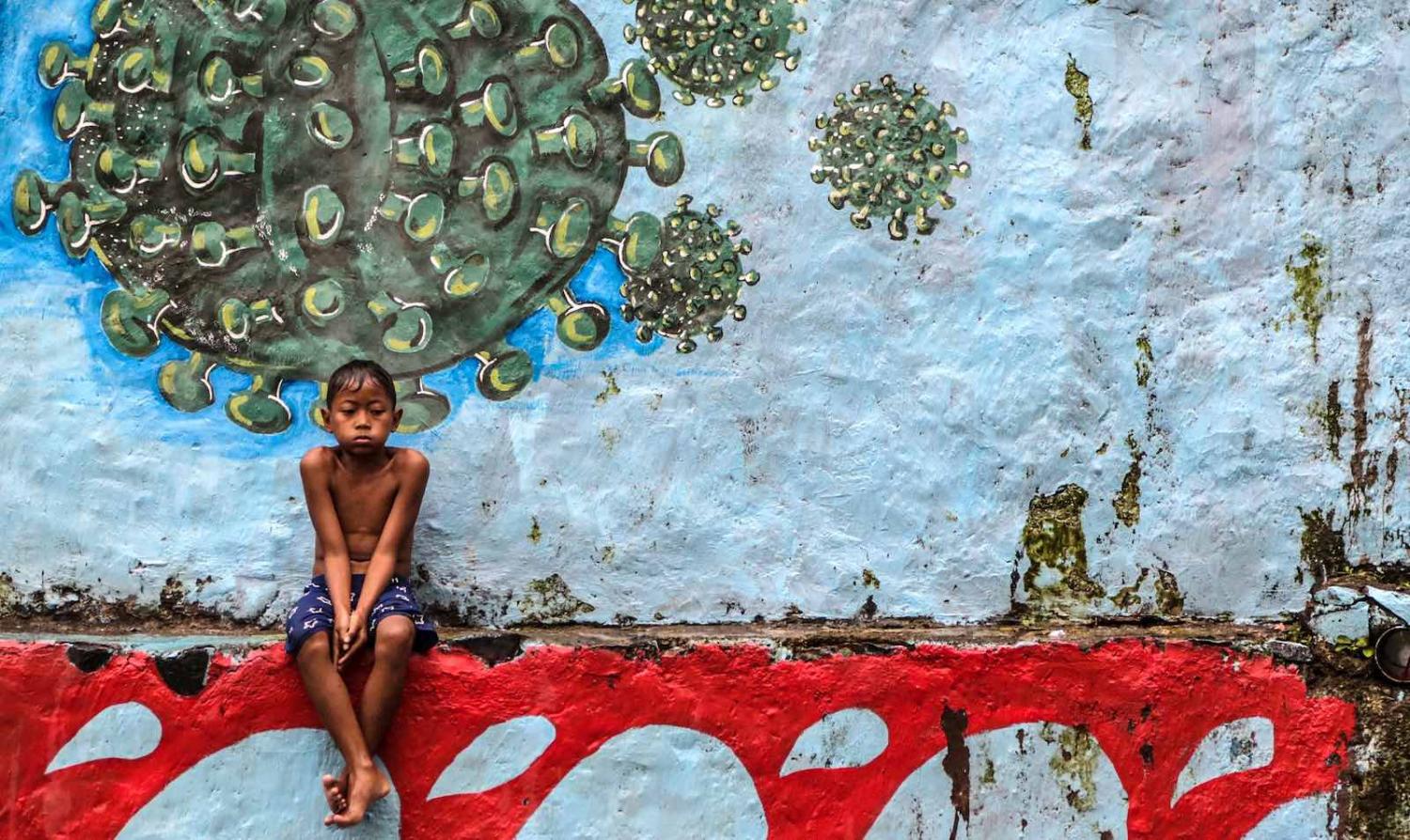 Bogor, West Java. It is reported the Covid-related mortality rate among Indonesian children has been 45 times higher than that of United States (Aditya Aji/AFP via Getty Images)