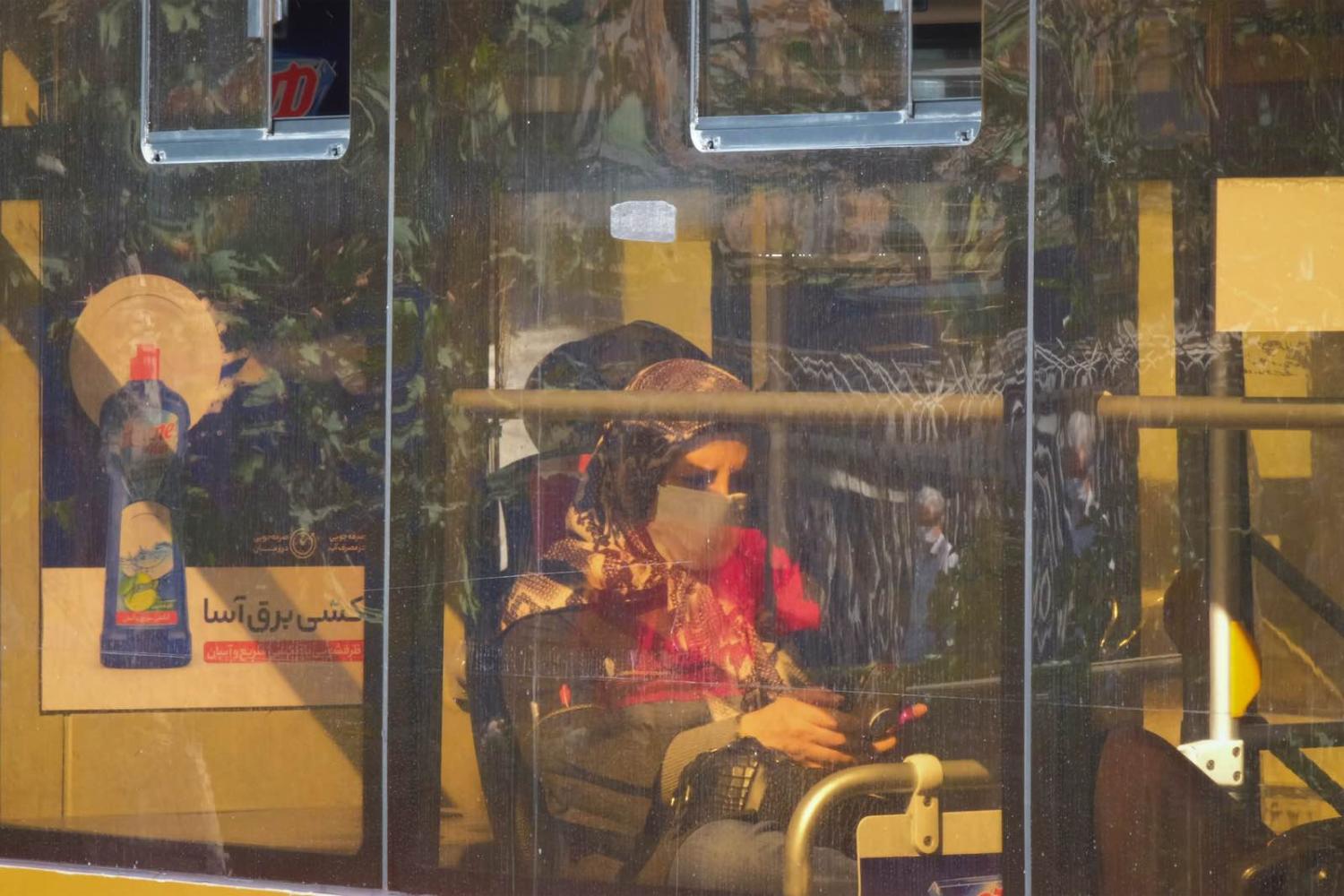 A woman on a bus in Tehran, October 2020 (Morteza Nikoubazl/NurPhoto via Getty Images)