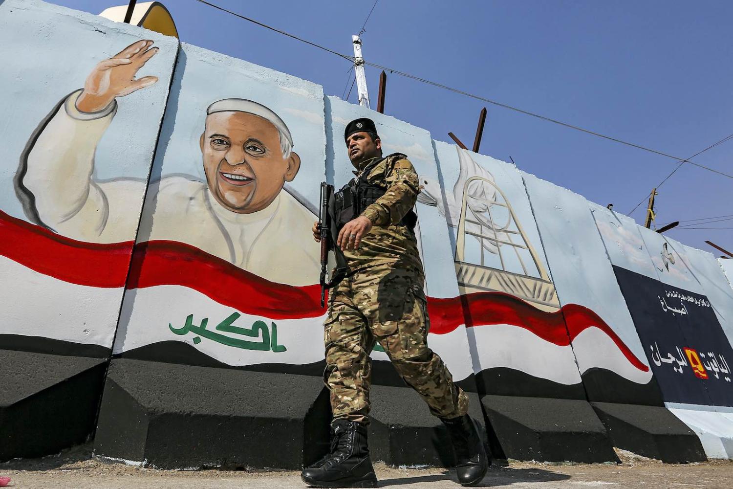 A mural depicting Pope Francis drawn on a blast wall outside the Syriac Catholic Church of Our Lady of Deliverance in the Karrada district of Iraq’s capital Baghdad, 1 March (Sabah Arar/AFP via Getty Images)