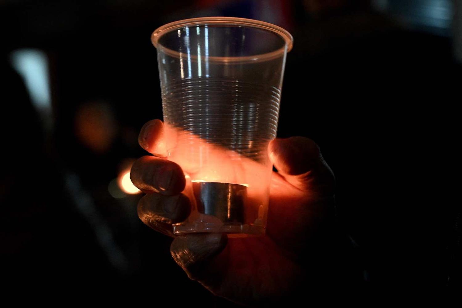 A candlelight vigil outside the Chinese consulate building in Sydney on 4 June 2021 to mark the anniversary of the 1989 Tiananmen Square crackdown (Saeed Khan/AFP via Getty Images)