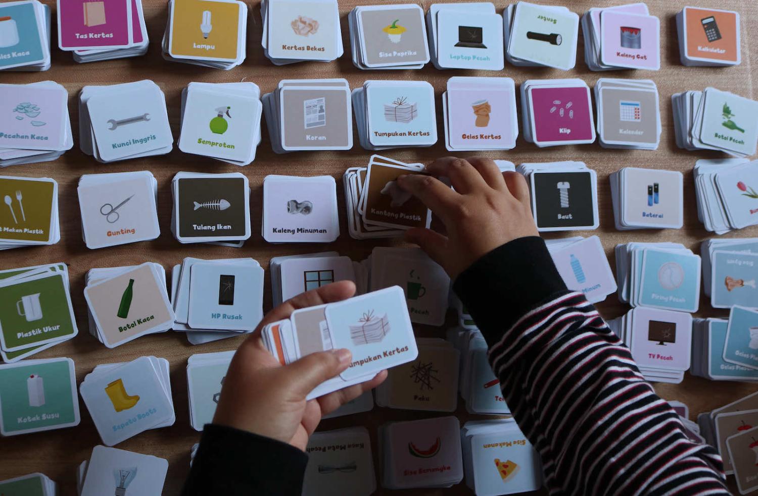 Making educational games for children with the theme to love the environment at a home industry in Malang, East Java, Indonesia, 20 August (Aman Rochman/NurPhoto via Getty Images)