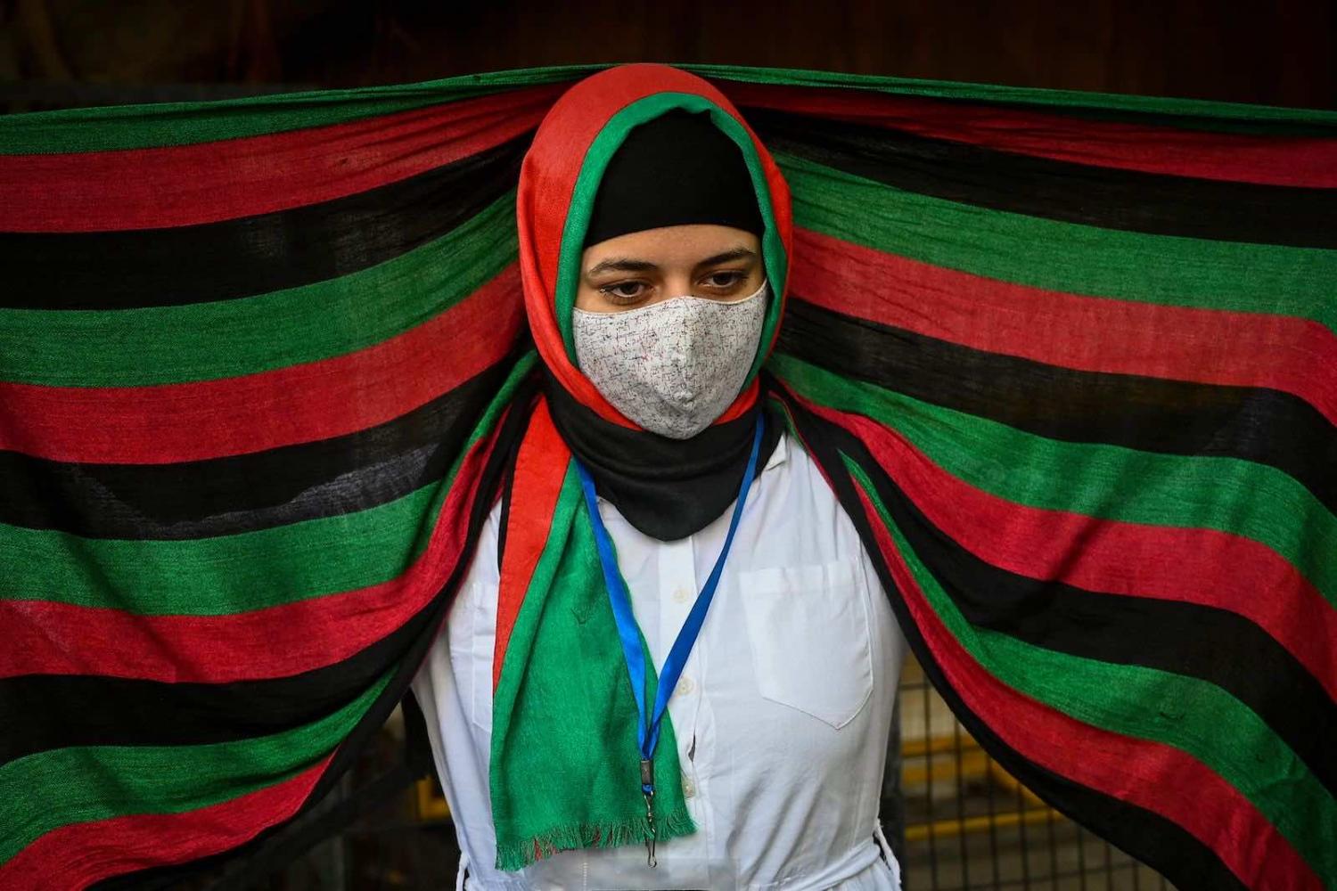 Afghans residing in India demonstrate outside the UN Refugee Agency office in New Delhi on 23 August to protest against the Taliban’s military takeover of Afghanistan (Sajjad Hussain/AFP via Getty Images)