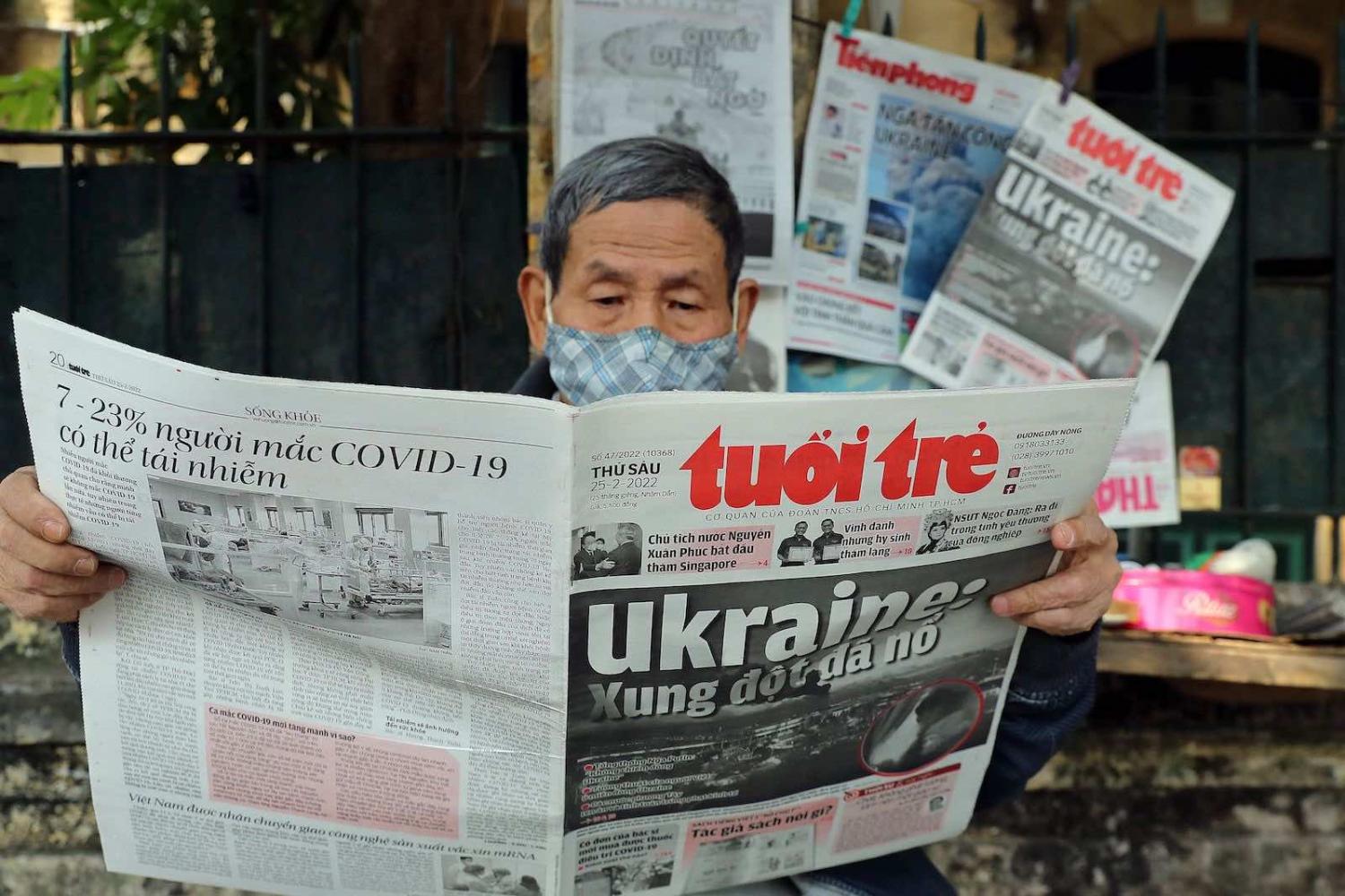 Front page coverage of the Russian invasion of Ukraine at a stall in Hanoi, Vietnam (Nam Nguyen/AFP via Getty Images)