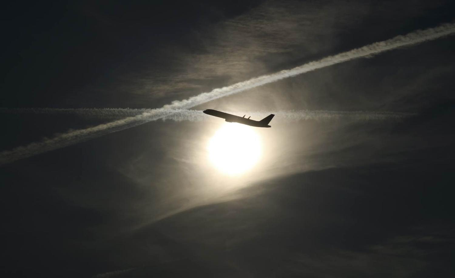 One solution might be to give everyone an annual allocation of kilometres that they could fly without penalty or shame (Photo: Gary Hershorn/Getty)