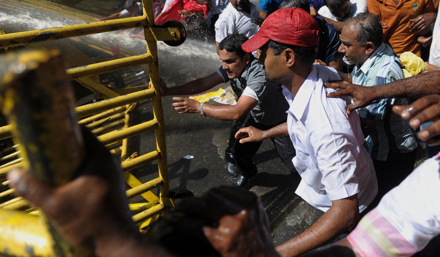 Police use water cannons during a protest in Colombo against the sale of Hambantota port to a Chinese company, 1 Feb  (Photo: I Shara Kodikara/Getty Images)