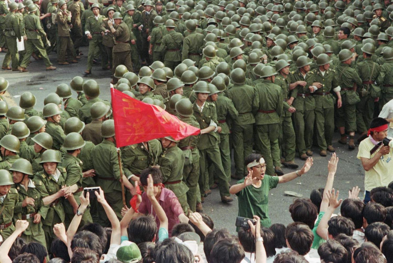Soldiers and demonstrators at Tiananmen Square (Photo: David Turnley via Getty)
