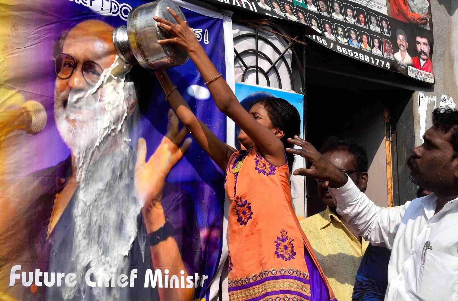 Fans of Tamil film superstar Rajinikanth celebrate the launch of his new political party in December (Antihuman Poyrekar via Getty)