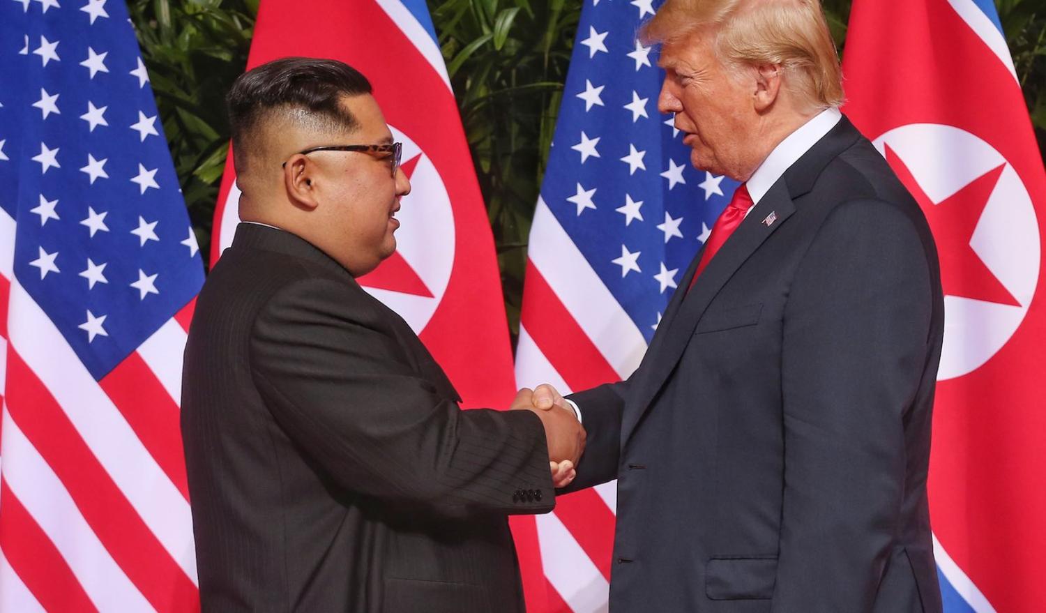 North Korean leader Kim Jong-un shakes hands with US President Donald Trump on Tuesday in Singapore (Photo: Kevin Lim via Getty)