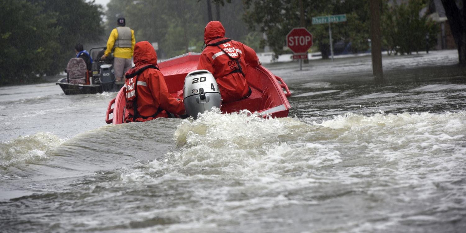 Coast Guard officers in a flood punt boat in Friendswood, Texas in the wake of Hurricane Harry (Photo:Coast Guard News/Flickr)