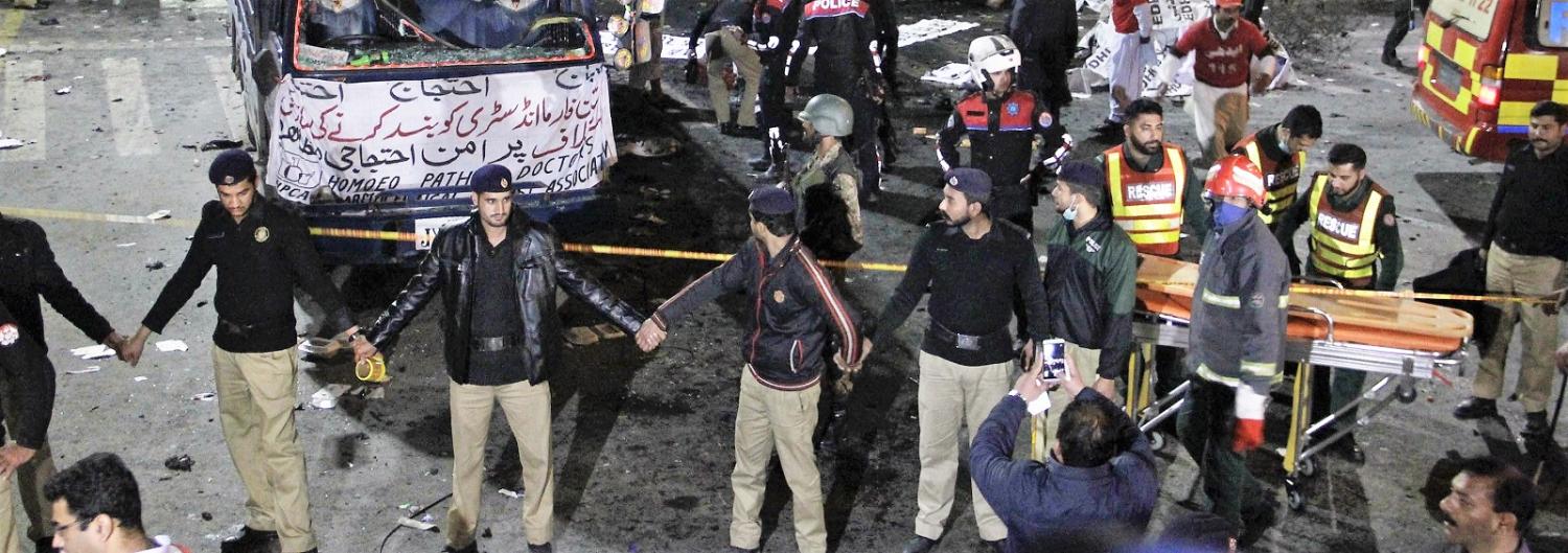 Pakistani security members at the site of Monday's bomb blast. (Photo:Rana Irfan Ali/Getty Images)