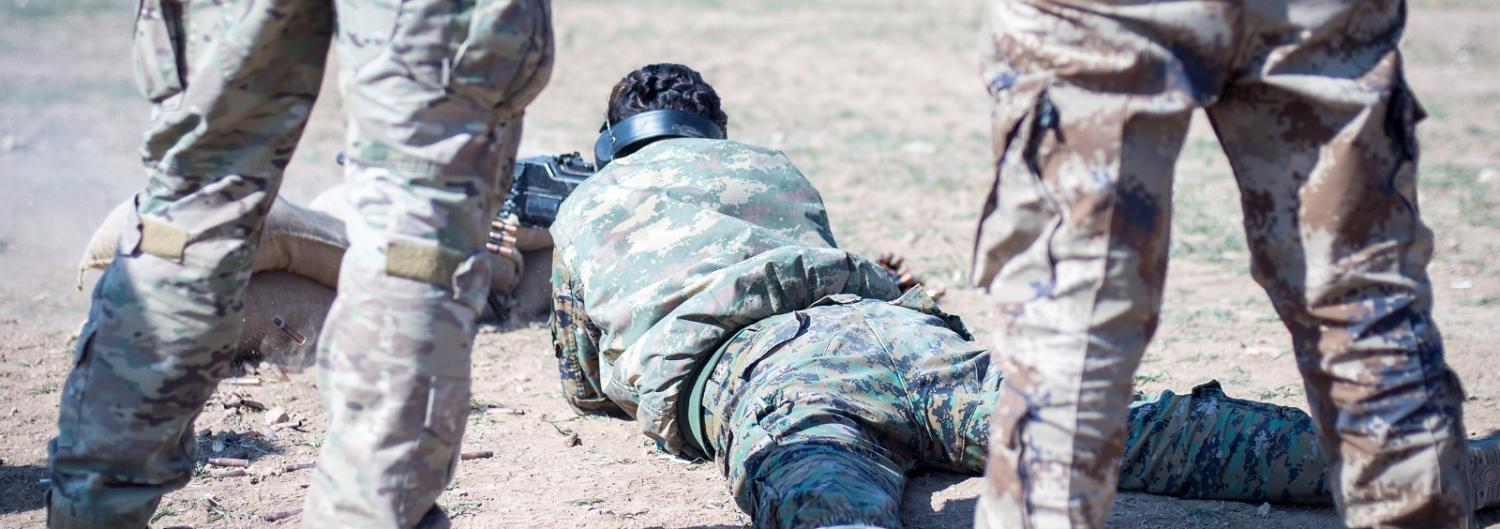 US Special Forces advise a local Manbji Military Council trainee on 21 Feb in North West Syria (Photo: US Army)
