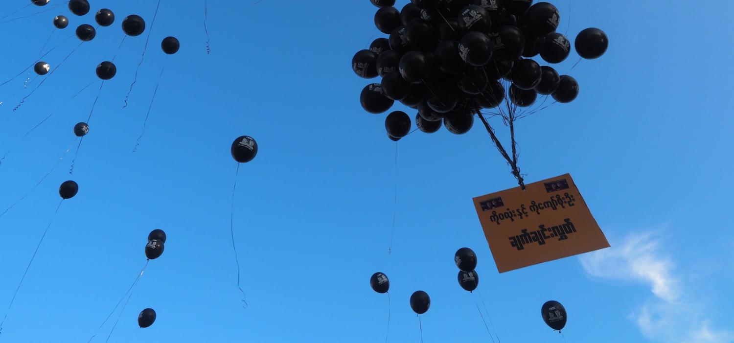 Balloons are released by activists at a protest against the sentencing of two Reuters journalists, Yangon,16 September (Photo: Connor MacDonald)