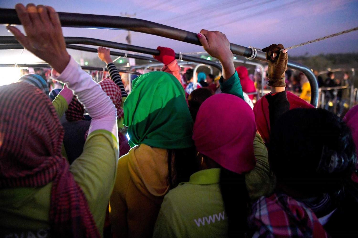 Garment factory workers in a truck on their daily commute, Cambodia, December 2019 (Tan Chhin Sothy/AFP via Getty Images)