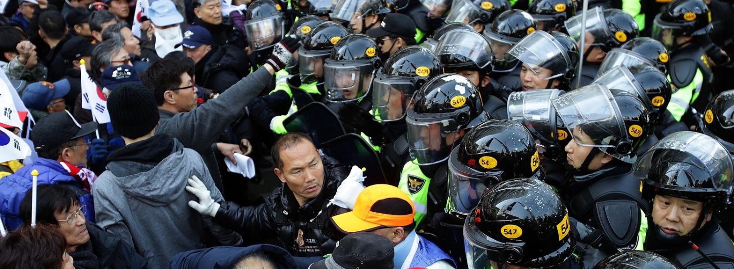 Supporters of Park Geun-hye are blocked by police after a rally in Seoul opposing her impeachment on 10 March. (Photo: Chung Sung-Jun/Getty Images)