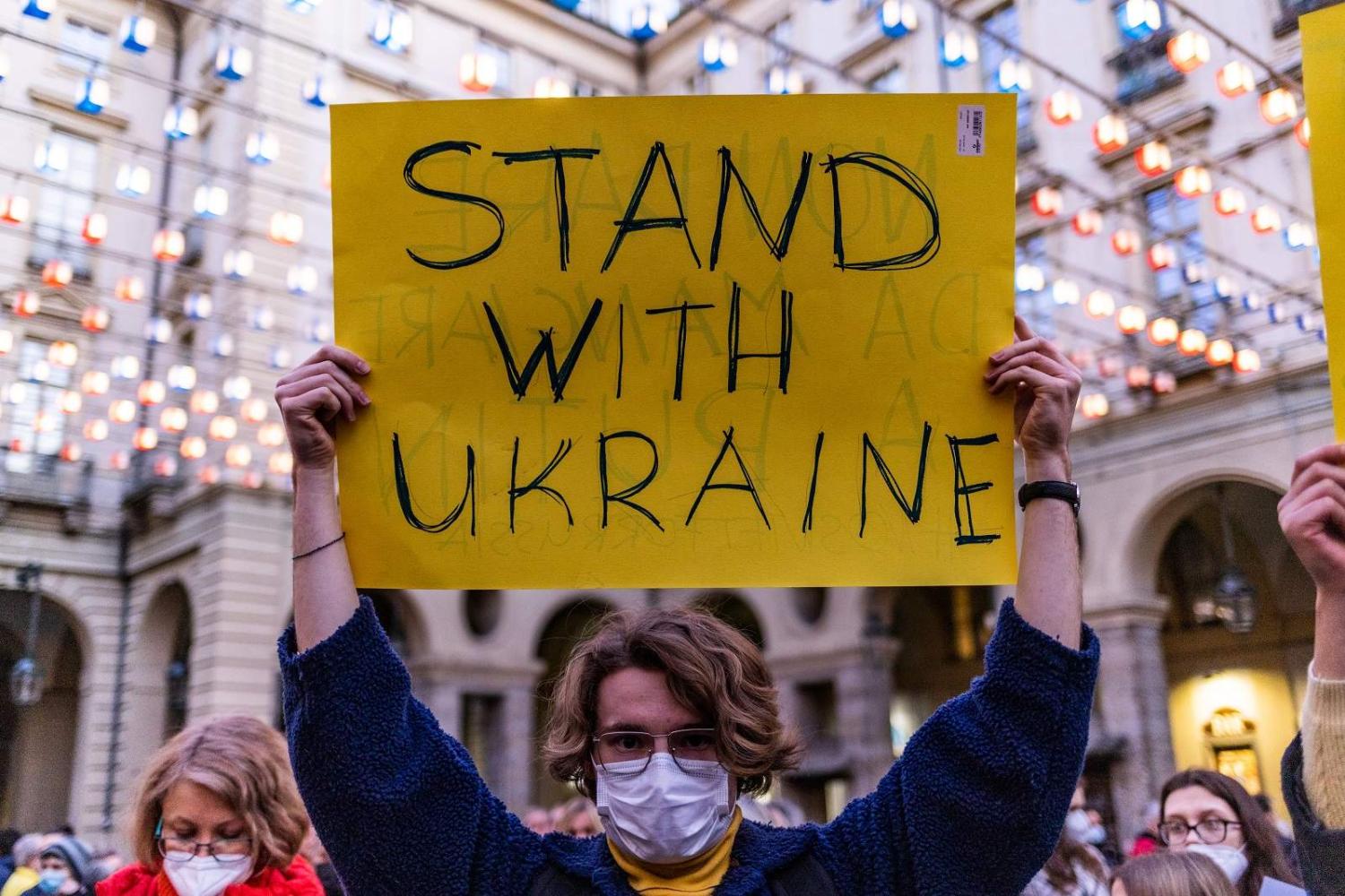 People gather in Turin, Italy, in support of Ukraine, 25 February 2022 (Mauro Ujetto/NurPhoto via Getty Images)