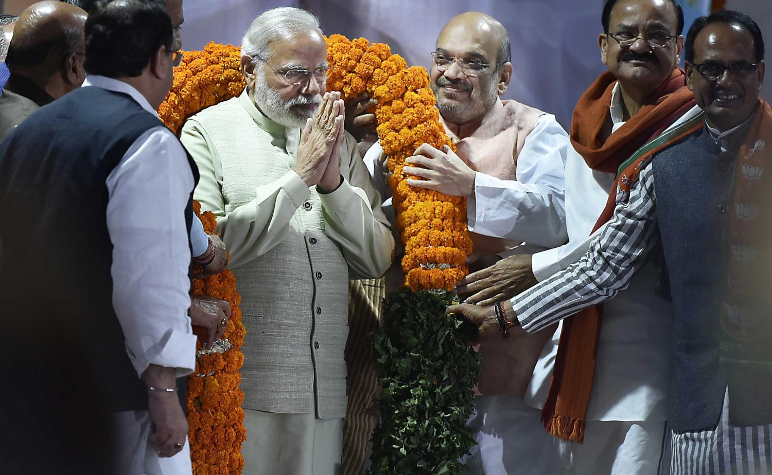 BJP leaders Amit Shah, Venkaiah Naidu, Shivraj Singh Chouhan and others greet Prime Minister Narendra Modi with a garland, March 2017 (Photo: Gtty Images/Hindustan Times/Raj K Raj)