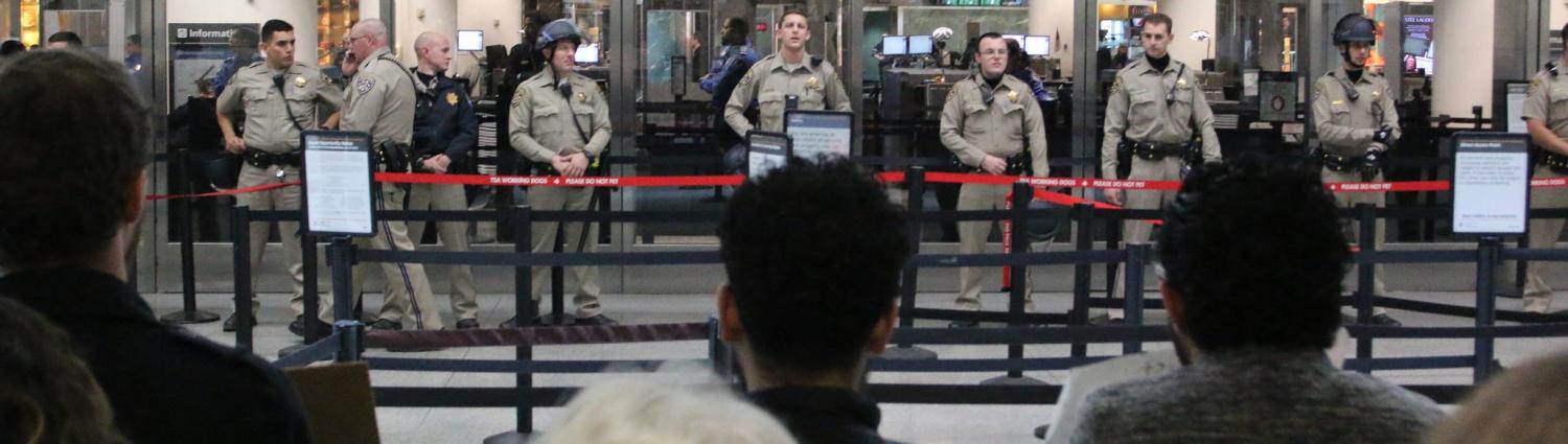 Holding the line against travel ban protesters at San Francisco International Airport (Photo: Flickr user Quinn Norton)